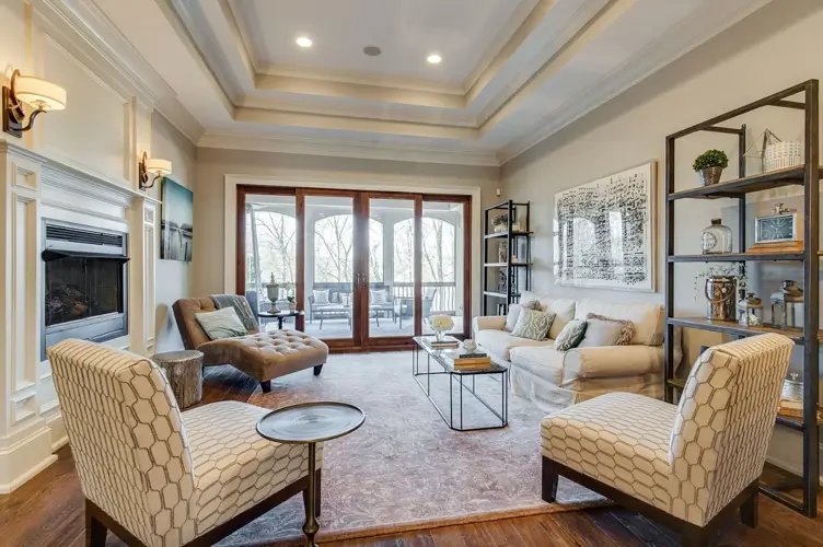 Theo Von Nashville house living room with coffered ceiling white fireplace and French doors