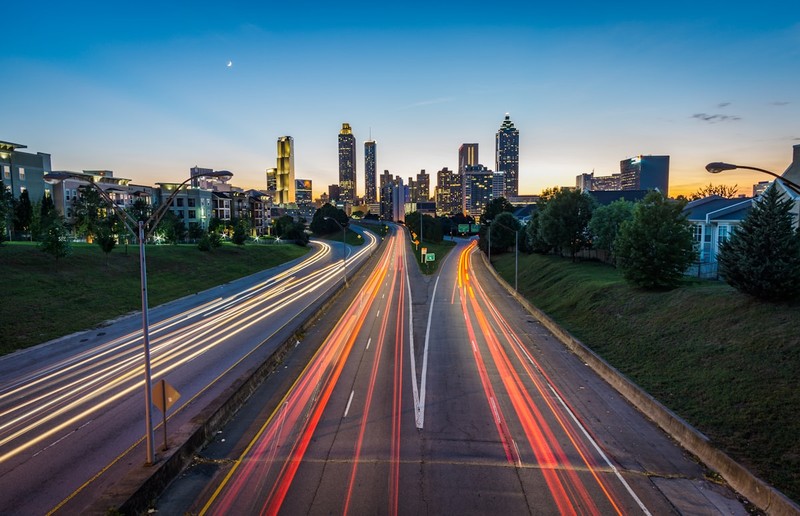 Atlanta Georgia city skyline at dusk with highway light trails showing the urban landscape