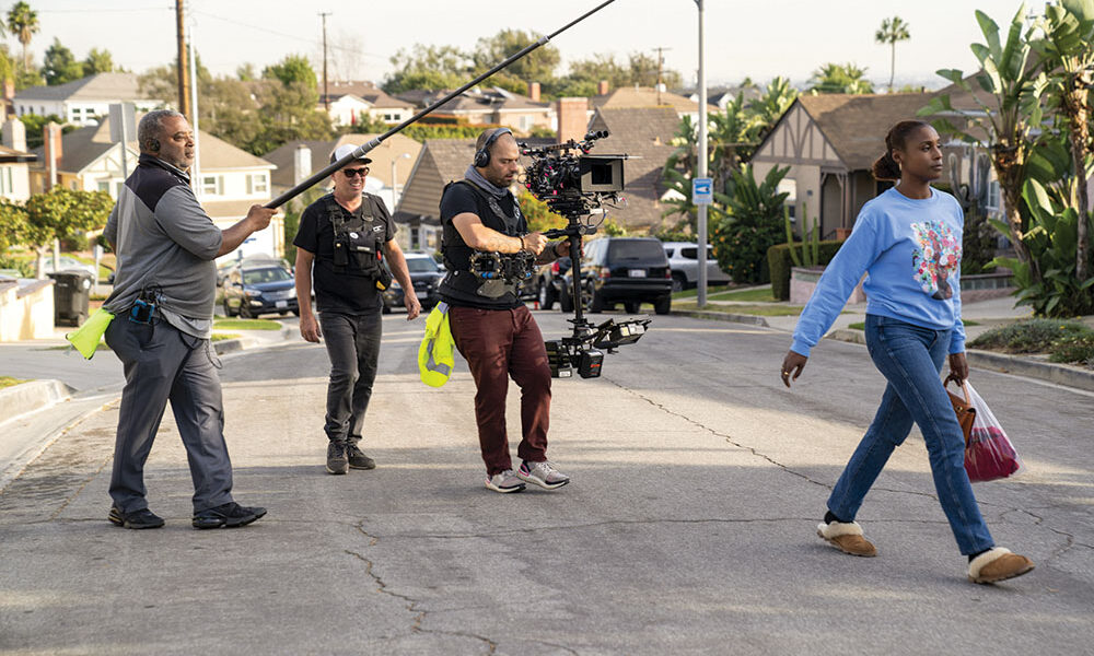 Craftsman-style residential homes along a tree-lined street in the Crenshaw neighborhood of South Los Angeles