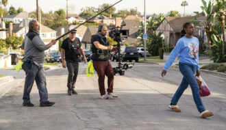 Craftsman-style residential homes along a tree-lined street in the Crenshaw neighborhood of South Los Angeles