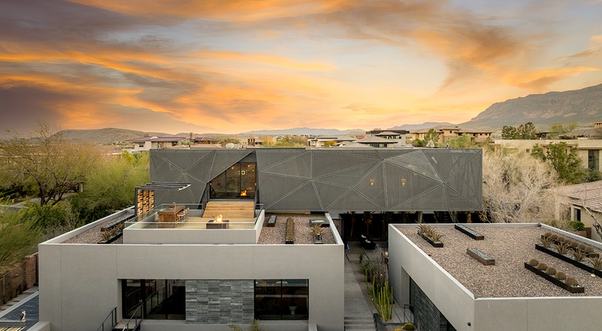 Jo Koy's Las Vegas mansion in The Ridges Summerlin features modern architecture with a striking metal mesh facade and rooftop terrace.