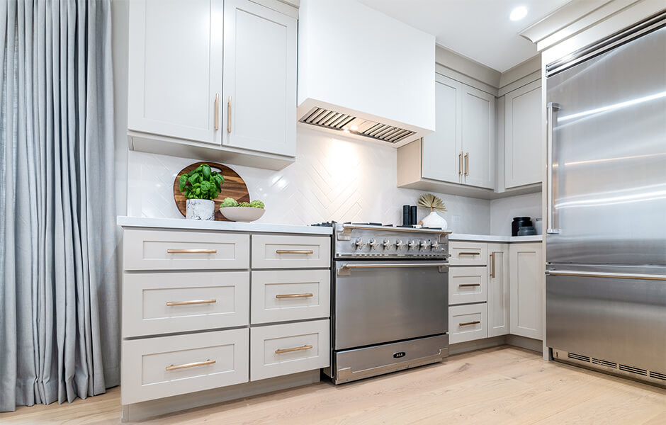 Kitchen renovation featuring quartz countertops and shaker cabinets from Tiffany Haddish Celebrity IOU HGTV project in Los Angeles