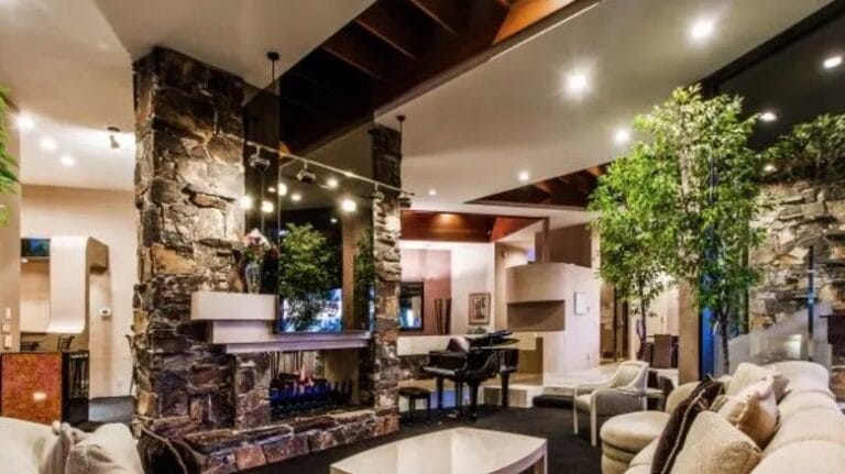 post-malone-house-living-room-stone-fireplace.jpeg