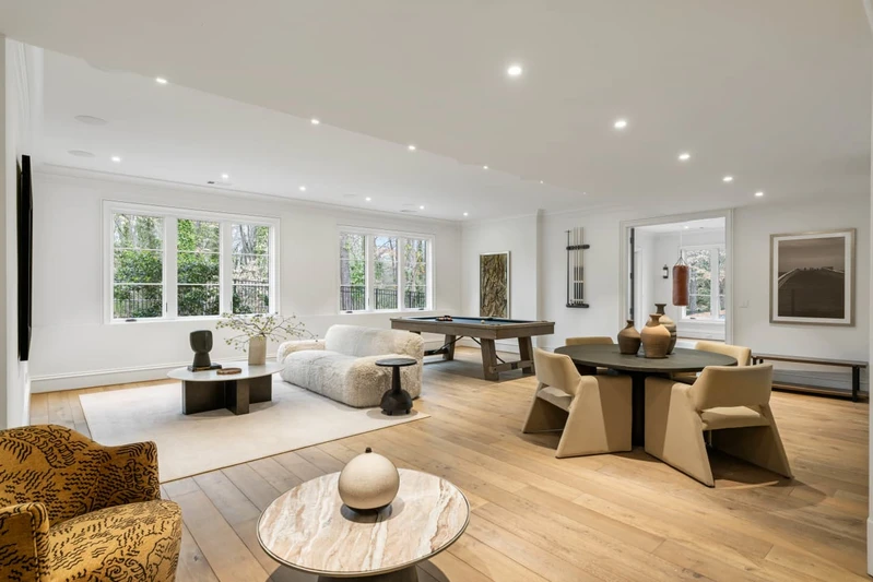 The open-concept kitchen and living area featuring high-end integrated appliances.