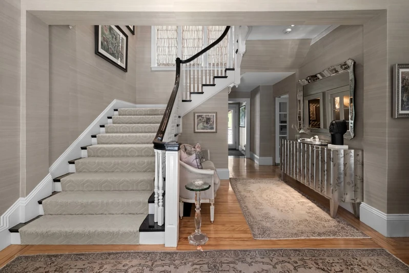 Interior finishes showcasing wide-plank walnut flooring and custom millwork.