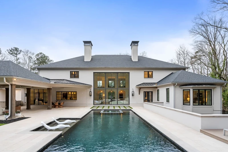 The resort-style saltwater pool and spa with covered outdoor dining area.