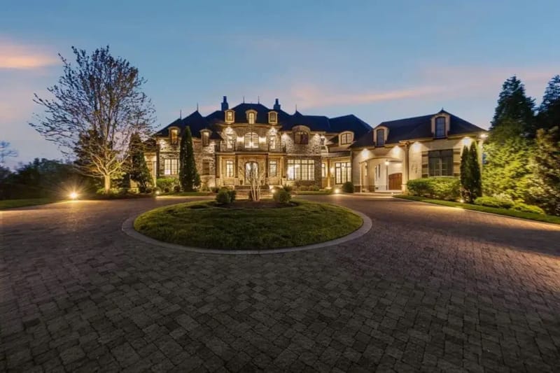 Grand formal living room inside Dave Ramsey former Franklin Tennessee estate featuring elegant furnishings and European-inspired architectural details