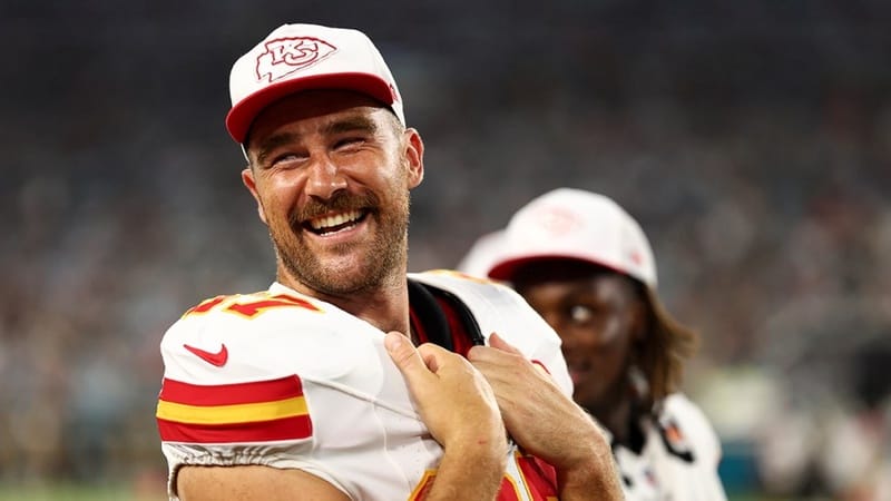 Travis Kelce wearing his Kansas City Chiefs jersey and cap during a game