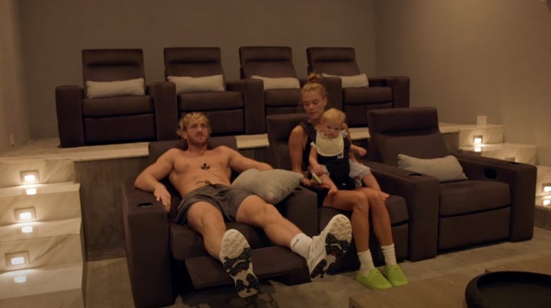 The home theater inside Logan Paul's Puerto Rico mansion features tiered leather recliners and ambient lighting. 